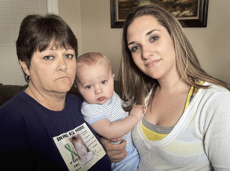 FAMILY: Trista Reynolds, holding her son Raymond Fortier, with her mother Becca Hanson in Portland last week. Raymond turned 1 on Saturday. Reynolds is the mother of Ayla Reynolds, who was reported missing on Dec. 17. Ayla’s second birthday is Wednesday.