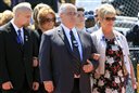 Family members for Greenland Police Chief Michael Maloney arrive for a memorial service Thursday April 19, 2012 in Hampton, N.H. Maloney was days away from retirement when he was fatally shot last Thursday.