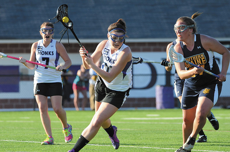 LEADING THE WAY: St. Joseph’s sophomore attacker Cassie Diplock, center, has had a strong season for the Monks. She leads the team with 49 goals in just 11 games.