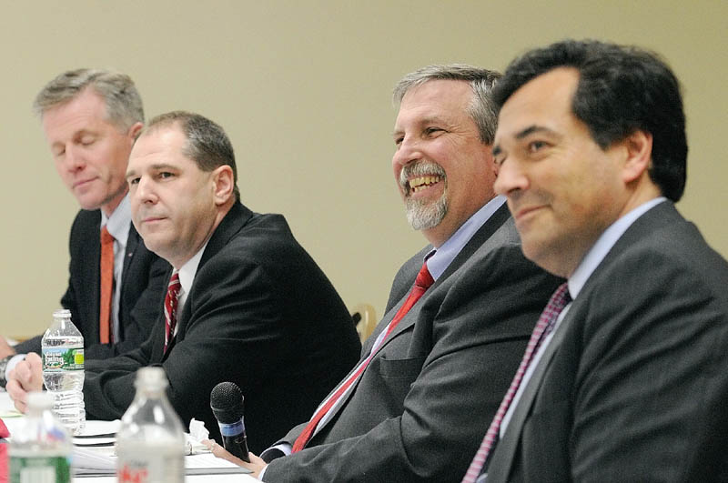 DEBATE: William Schneider, second from right, laughs after hearing a question from host Phil Harriman during the GOP For ME debate on Friday night at the Elks Club in Augusta. Charlie Summers, far left, Scott D’Amboise, second from left, and Rick Bennett await their turn.