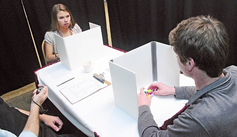 Alexis Lane, left, asks a question as her Messalonskee High School teammate Christopher Boucher tries to describe to her how to build an item out of Lego blocks during a communications event at the Jobs for Maine’s Graduates’ annual conference on Friday at the Augusta Civic Center.