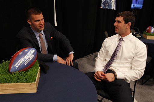 Stanford quarterback Andrew Luck (R), right, waits with Stanford's Coby Fleener (L) before the first round of the NFL football draft at Radio City Music Hall, Thursday, April 26, 2012, in New York. (AP Photo/Jason DeCrow)