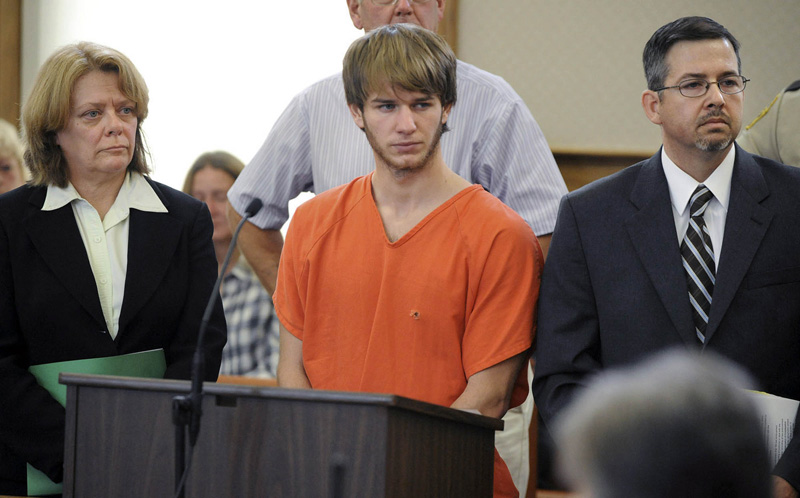 This 2010 photo shows Thayne Ormsby, center, with his attorneys. Ormsby's triple-murder trial began today in Aroostook County.