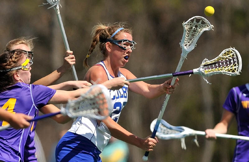 Staff Photo by Michael G. Seamans Colby College's Lindsey McKenna, 25, takes a shot on goal against Williams College in the first period at Colby College in Waterville on Saturday.