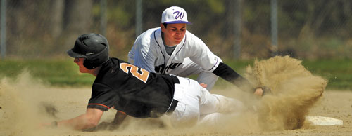 HE’S OUT: Waterville Senior High School second baseman Lance Lefebvre, right, tags out Winslow High School’s Joe Hopkins on a steal attempt in the third inning Wednesday at Winslow High School.