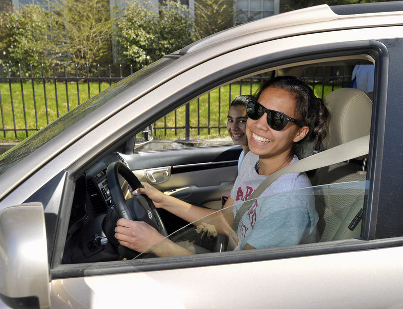 Eleni Anderson, 18, reacts to the new driving law as she picks up her sister, Megan, at Portland High on Friday. “Teenagers won’t like it, but they aren’t really thinking in the long run,” she said.