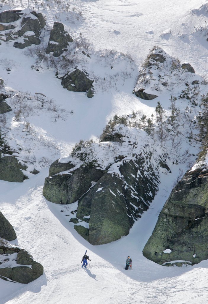 A skier hikes up Mt. Washington on a section of Tuckerman Ravine in New Hampshire called The Chute. Despite a bad snow season, Mt. Washington received a late dump of snow that has led to above-average conditions.