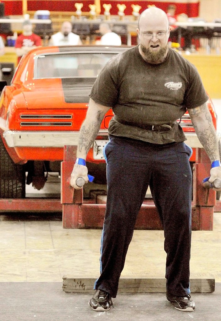 HEAVY LIFTING: Jesse Coffin of Raymond deadlifts a Firebird during the fifth annual Central Maine Strongman competition on Saturday at the Augusta Armory.