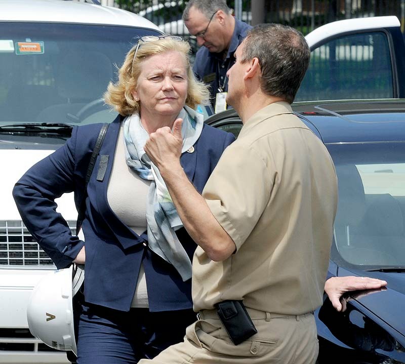 U.S. Rep. Chellie Pingree speaks with Capt. Bryant Fuller at Portsmouth Naval Shipyard in Kittery, site of a submarine fire that broke out Wednesday.