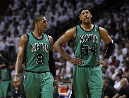 Boston Celtics' Paul Pierce (34) and Rajon Rando (9) talk during the first half of Game 1 in their NBA basketball Eastern Conference finals playoffs series against the Miami Heat, Monday May, 28, 2012, in Miami. (AP Photo/Lynne Sladky)