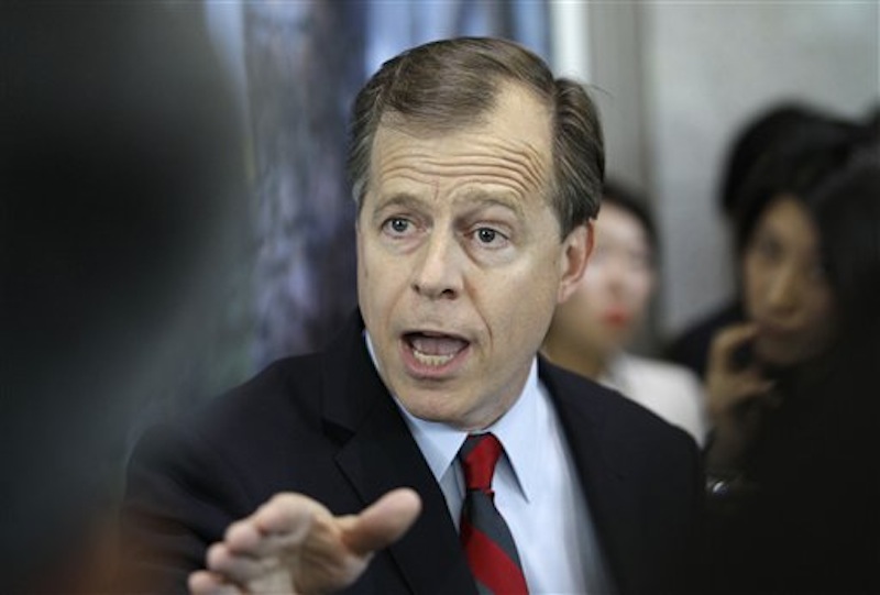 U.S. envoy on North Korea, Glyn Davies answers reporter's questions after meeting with South Korea's chief nuclear envoy Lim Sung-nam and Lim's Japanese counterpart Shinsuke Sugiyama at the Foreign Ministry in Seoul, South Korea, Monday, May 21, 2012. The top U.S. envoy for North Korea is warning Pyongyang that any nuclear test will be met with "swift and sure" international punishment. (AP Photo/Lee Jin-man) Glyn Davies