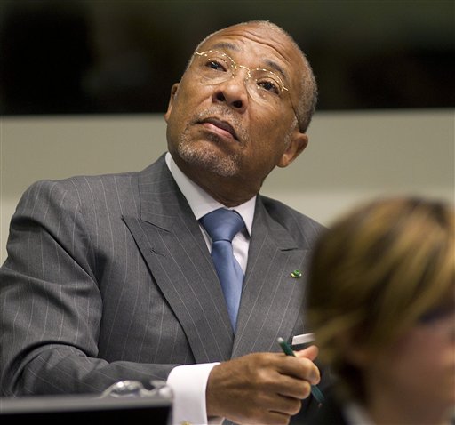Former Liberian President Charles Taylor looks up to the public gallery as he waits for the start of his sentencing hearing in Leidschendam, near The Hague, Netherlands, today.