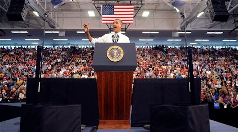 President Barack Obama waves as he delivers an address on the economy, jobs and taxes at Florida Atlantic University in Boca Raton, Fla., Tuesday, April 10, 2012. (AP Photo/South Florida Sun Sentinel, Mark Randall)