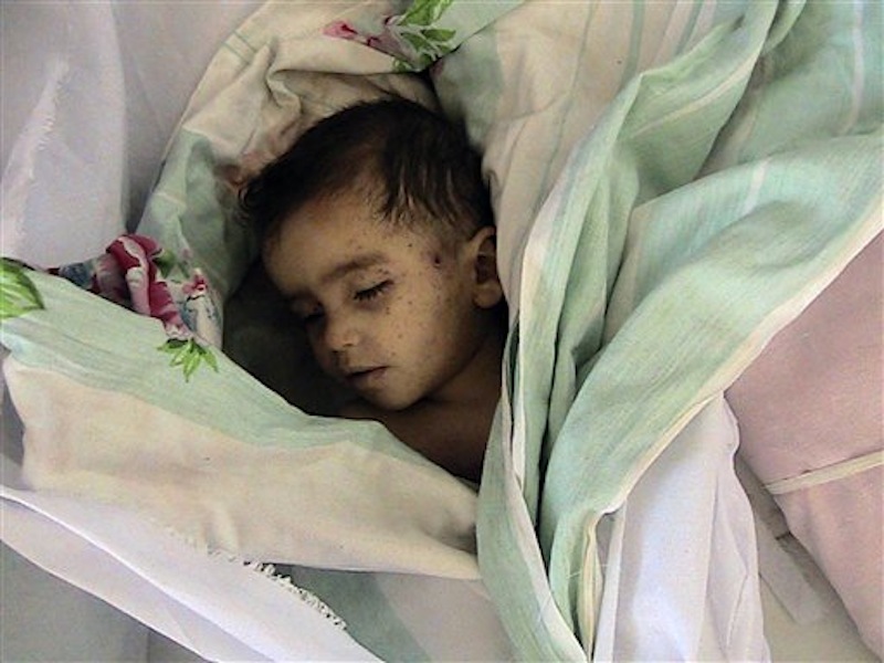 This citizen journalism image provided by Shaam News Network taken Saturday, May 26, 2012, purports to show a dead child following a Syrian government assault on Houla, Syria. The Syrian government denied Sunday its troops were behind an attack on a string of villages that left more than 90 people dead, blaming the killings on "hundreds of heavily-armed gunmen" who also attacked soldiers in the area. Friday's assault on Houla, an area northwest of the central city of Homs, was one of the bloodiest single events in Syria's 15-month-old uprising. The U.N. says 32 children under 10 were among the dead. (AP Photo)