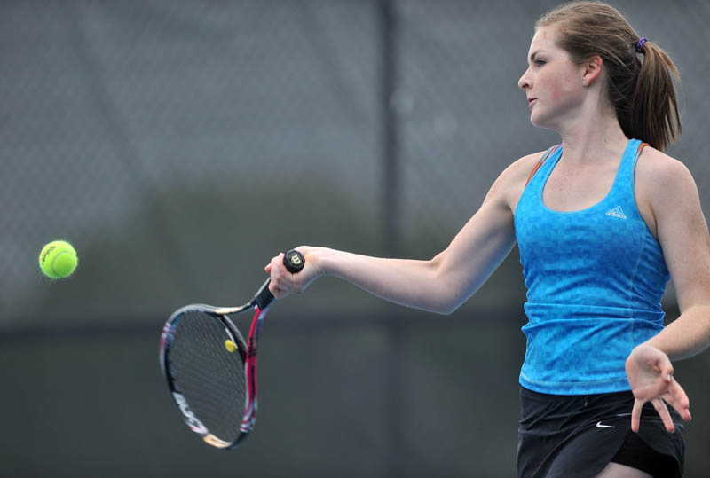 FOREHAND RETURN: Waterville’s Olivia Lopes returns a shot from Mount Desert Island’s Mia-Cara Musetti during the first round of the singles tennis tournament Friday in Waterville. Lopes won 6-1, 6-0 before losing in the second round to Annie Criscione, 6-1, 6-3.