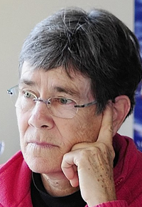 MaineHousing executive director Dale McCormick listens to a conference call on Friday morning in her Augusta office. File photo