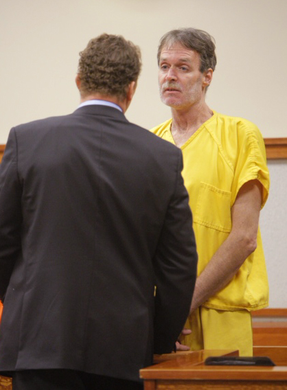 Brian Kelley talks to his lawyer, Peter Cyr, in Superior Court today.