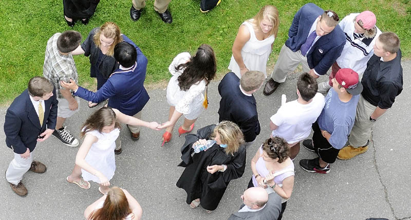 Students, parents and facualty chat in front of Bearce Hall before graduation ceremonies at Kents Hill School on Saturday morning in Readfield. There were 66 students in the 188th graduating class of the private preparatory school Saturday, Their 2012 class featured students from seven countries and 13 Maine communities.