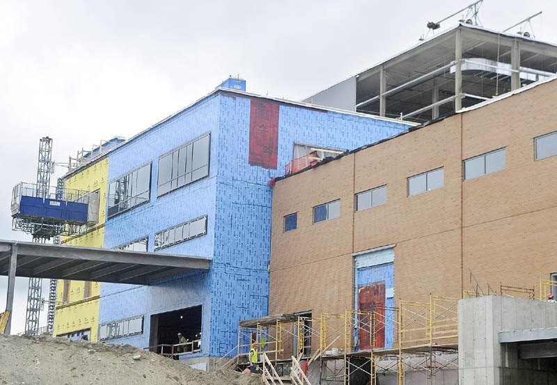 The walls of the loading dock already have the brick finish as other stages of construction are seen behind them at MaineGeneral's new regional hospital under construction in North Augusta.