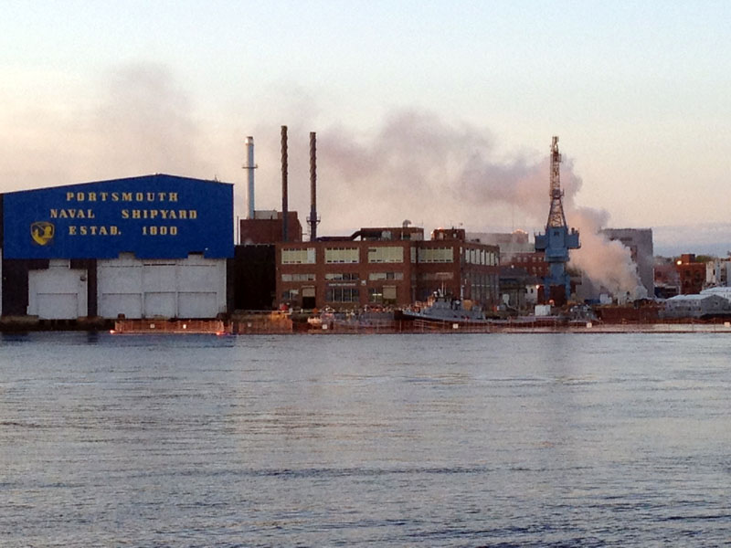 A fire burns on a nuclear submarine at the Portsmouth Naval Shipyard in Kittery, Maine, Wednesday, May 23, 2012. Fire crews responded Wednesday to the USS Miami SSN 755 at the Portsmouth Naval Shipyard but the cause of the fire has not yet been identified.