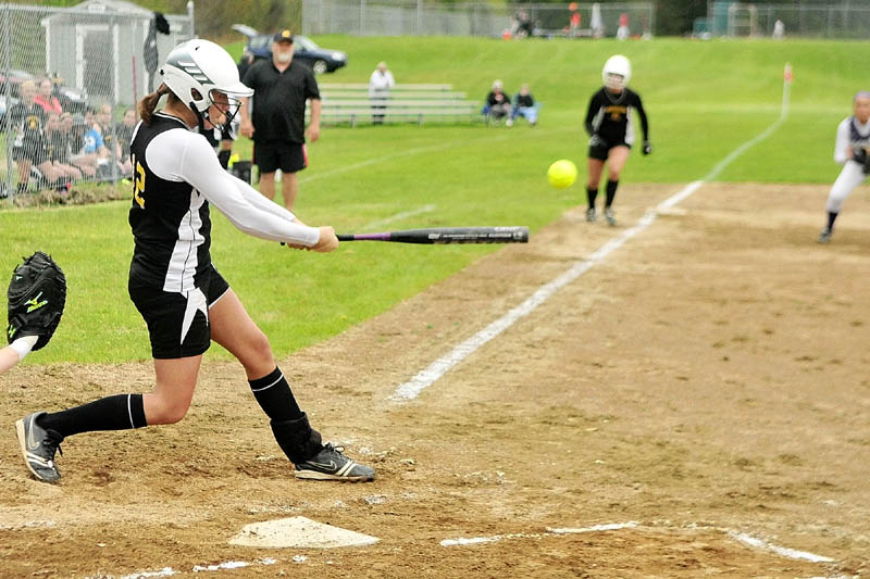 BIG HIT: Maranacook’s Sarah Boynton hits a home run that scored teammate Jessie Smith from third base during the Black Bears’ 5-1 win on Wednesday in Readfield.