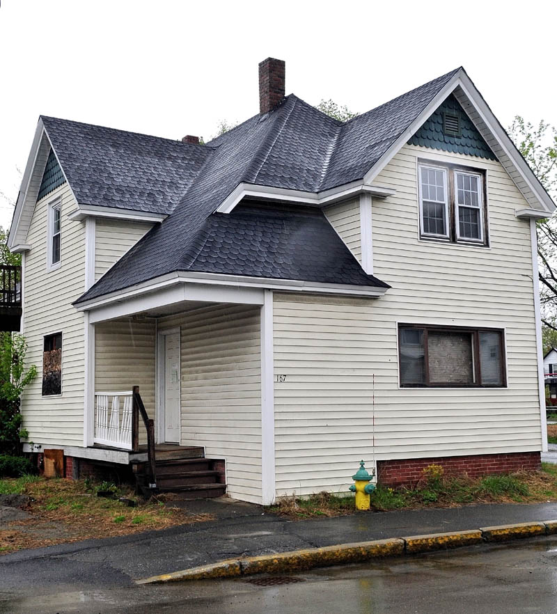 UP FOR GRABS: The city of Waterville is deciding the value and future use of this home at 167 Water St. that was taken for unpaid taxes.