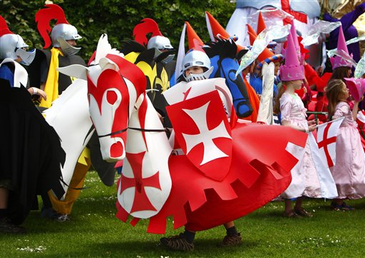 A young "knight" on horseback from joins the parade through the town of Chichester, England, as part of the celebrations to mark Queen Elizabeth II's Diamond Jubilee celebrations.