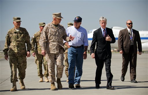 U.S. Defense Secretary Leon Panetta, center right, speaks with U.S. Ambassador to Afghanistan Ryan Crocker, second right, and the head of NATO coalition forces in Afghanistan Gen. John Allen, center left, upon his arrival at Kabul International Airport in Kabul, Afghanistan today.