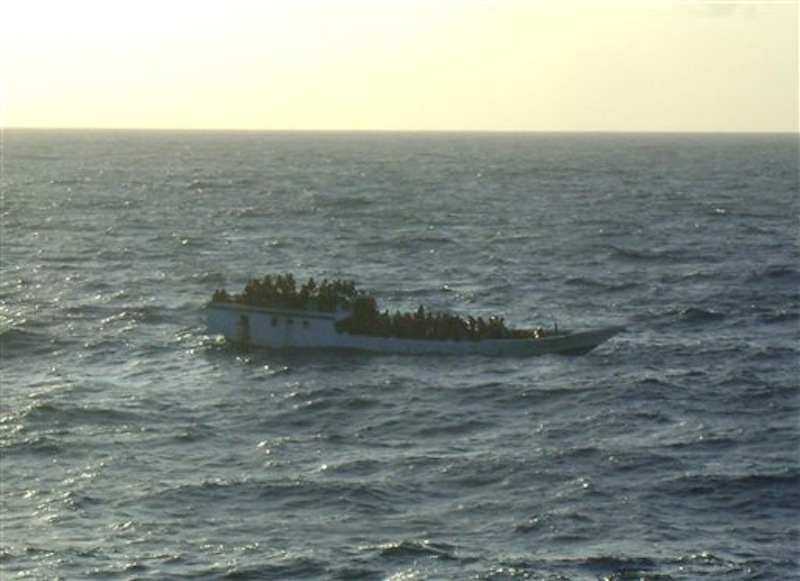 This June 27, 2012 photo released by Australian Maritime Safety Authority shows a boat carrying asylum seekers 200 kilometers (120 miles) north of Christmas Island in the Indian Ocean hours before capsizing Wednesday, June 27, 2012. The boat capsized Wednesday and 123 people were rescued from the ocean, Prime Minister Julia Gillard said, less than a week after more than 90 people drowned on a similar journey. (AP Photo/Australian Maritime Safety Authority)