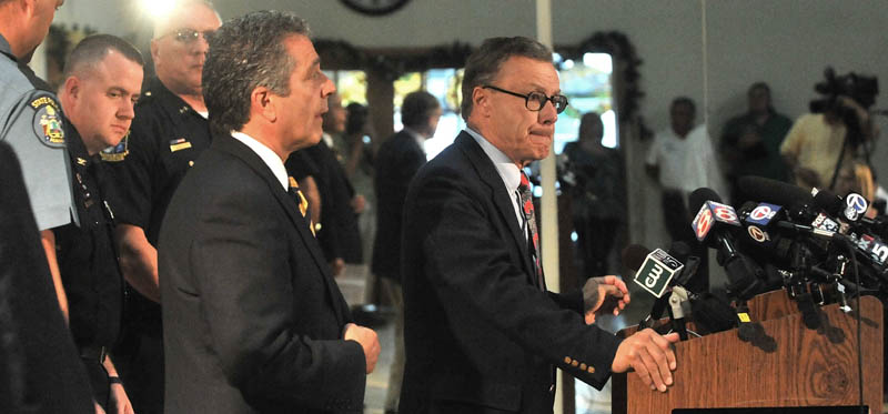 Maine State Police spokesman Steve McCausland, center right, introduces Attorney John Nale, center left, during a press conference Thursday about the Ayla Reynolds investigation in Waterville.