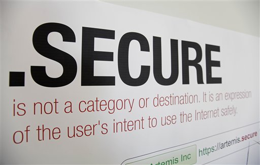 A domain name poster is displayed recently at the offices of Artemis Internet, a San Francisco company. Some 2,000 proposals have been submitted as part of the largest expansion of the Internet address system since its creation in the 1980s. The organization behind it, the Internet Corporation for Assigned Names and Numbers, will announce a full list and other details in London on Wednesday.