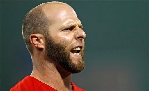 Boston Red Sox's Dustin Pedroia yells after grounding out with one runner on base to end the eighth inning against the Atlanta Braves in a baseball game at Fenway Park in Boston, Friday, June 22, 2012. (AP Photo/Charles Krupa)