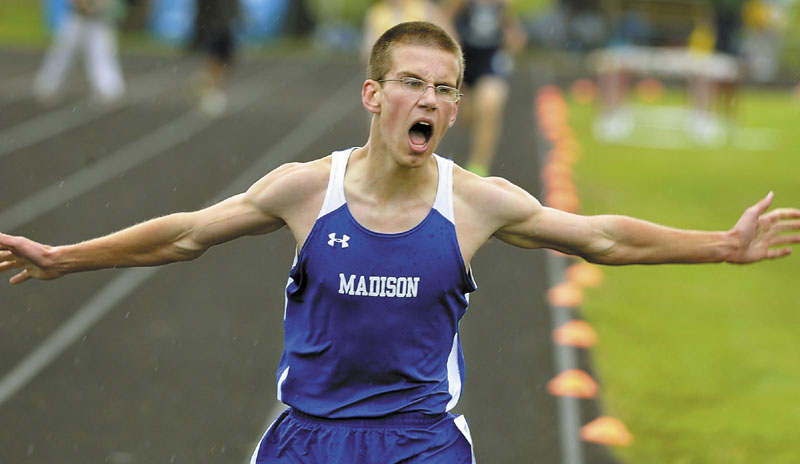 YEAH, I DID IT: Matt McClintock of Madison reacts to his time on the clock showing he broke the Class C state record in the 1,600-meter run Saturday at Cony High School in Augusta.