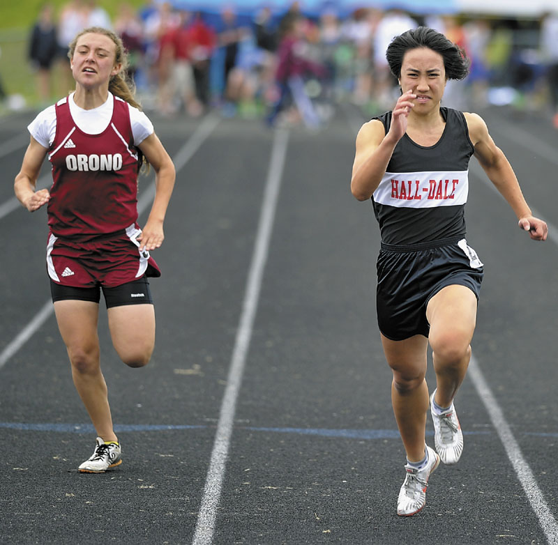RACE TO THE FINISH: Hall-Dale High School’s Bri Crisci, right runs to victory in the 100-meter dash at the Class C state championship track and field meet at Cony High School in Augusta on Saturday. Crisci finished in 13.34 seconds. Orono’s Diana Tyutyunnyk was second in 13.64.