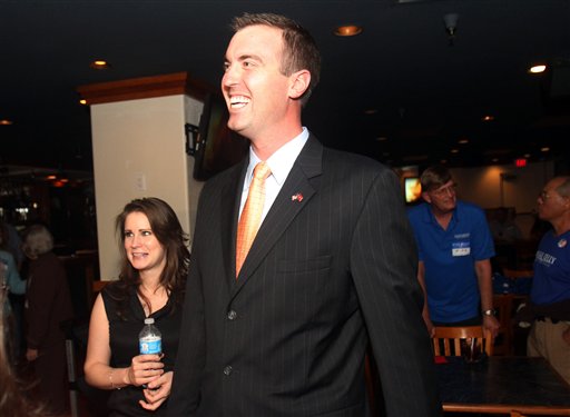 Jesse Kelly, center, Republican candidate for southern Arizona's 8th Congressional District, in an April 17, 2012, photo,