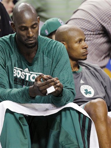 Boston Celtics' Kevin Garnett, left, and Ray Allen sit on the bench near the end of the fourth quarter in Game 6 of the NBA basketball Eastern Conference finals against the Miami Heat, Thursday, June 7, 2012, in Boston. Miami won 98-79. (AP Photo/Elise Amendola)