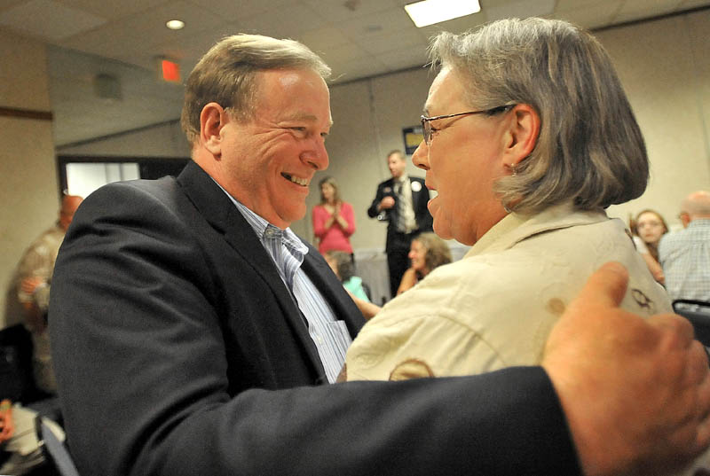 Kevin Raye is congratulated by supporter Gail Kelly after winning the Republican nomination in the 2nd District U.S. House race in Bangor Tuesday night.