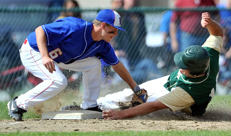 MAKE THE TAG: Messalonskee High School third baseman Travis St. Pierre, left, tags out Oxford Hills High School’s Jordan Croteau on an attempted steal in the second inning of their Eastern A quarterfinal Wednesday at Thomas College in Waterville.