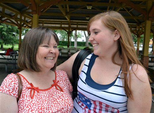 Trish Nixon, left, stands with her 21-year-old daughter, Krista Nixon, in Colorado Springs, Colo. Trish Nixon talks about the challenge she has faced over the years about marijuana. Nixon said the message to her daughter changed over the years, evolving from "It's against the law, don't do it," to a more nuanced message that takes into consideration medical marijuana and ballot initiatives to legalize the drug.