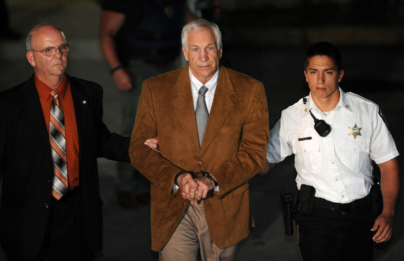 Jerry Sandusky leaves the Centre County Courthouse Friday after being found guilty in his sexual abuse trial, in Bellefonte, Pa. Sandusky was convicted of sexually assaulting 10 boys over 15 years Friday, accusations that had sent shock waves through the college campus known as Happy Valley and led to the firing of Penn State's beloved Hall of Fame coach, Joe Paterno. (