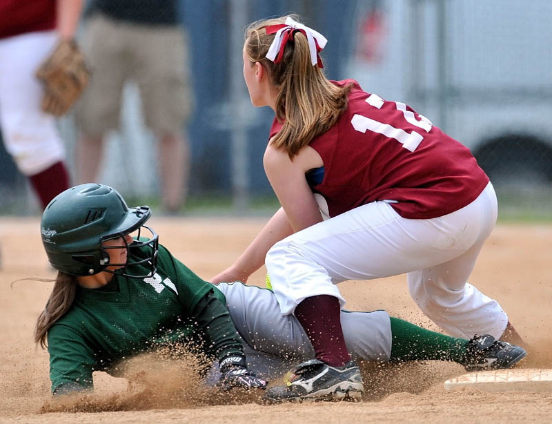SAFE: Penobscot’s Alissa Whitten slides safely in to second base under the tag of Richmond’s Brianna Snedeker during the Class D softball state title game Saturday in Brewer.