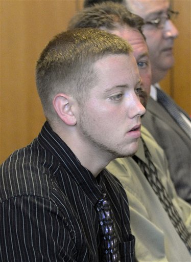 Aaron Deveau, 18, sits next to his father and lawyer during his trial in Haverhill, Mass., on Tuesday. Deveau is first person to be tried in Massachusetts on a charge of motor vehicle homicide while texting.
