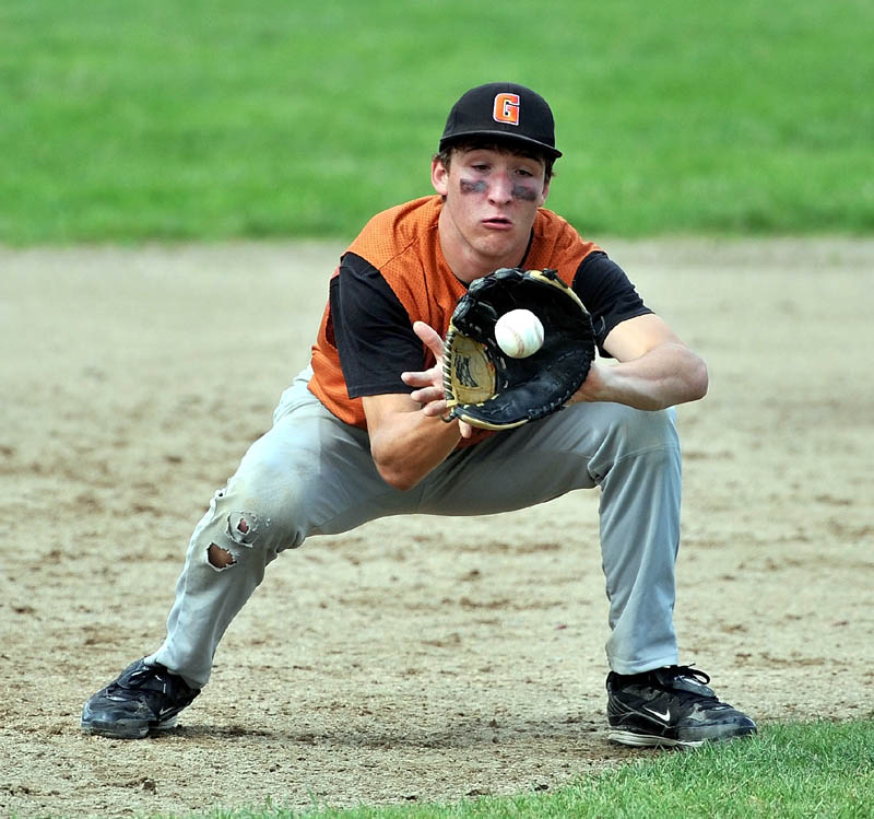 Staff Photo by Michael G. Seamans Gardiner High School third baseman Hunter Belanger, 12, fields a hard hit groundball in the Eastern Class B Regional quarter finals game at Waterville High School Thursday. Waterville defeated Gardiner 11-1.