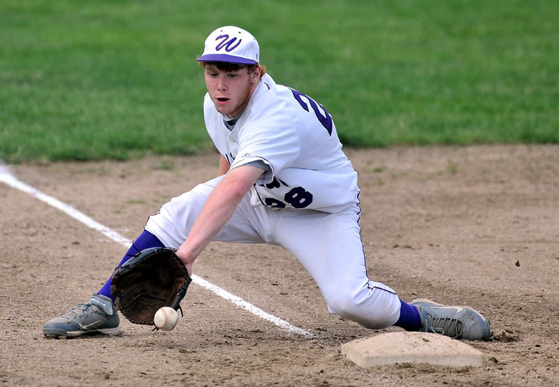 Staff Photo by Michael G. Seamans Waterville Senior High School thrid baseman Daniel Pooler, 28, fields a ball that barely made it to foul territory against Gardiner High School in the Eastern Class B Regional quarter finals game at Waterville High School Thursday. Waterville defeated Gardiner 11-1.