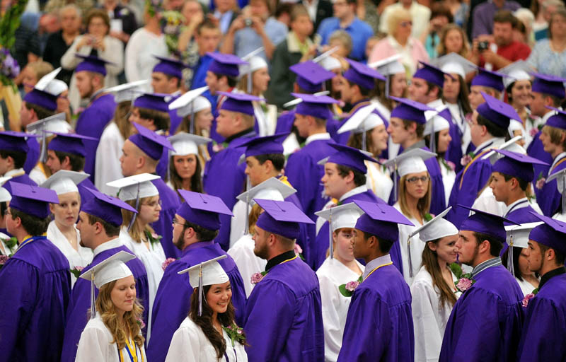 Staff Photo by Michael G. Seamans Waterville Senior High School's 2012 graduated march in to Wadsworth Gymnasium at Colby College in Waterville Thursday during commencement ceremonies.