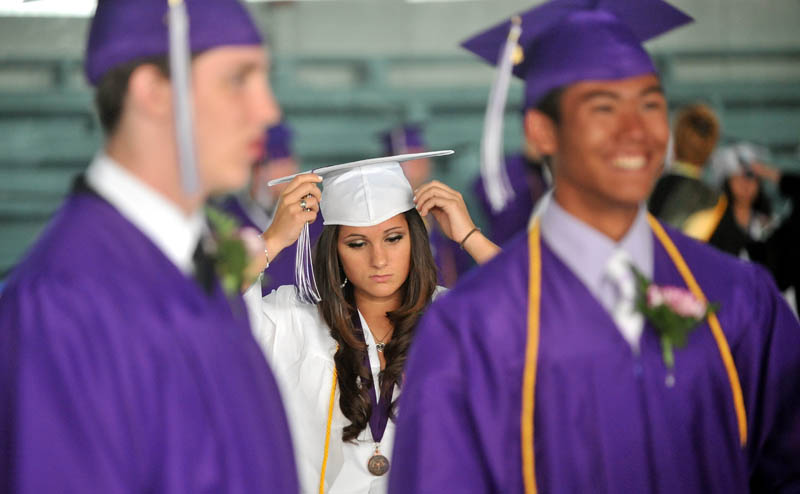 Staff Photo by Michael G. Seamans Waterville Senior High School graduates prepare for commencement ceremonies at Wadsworth Gymnasium at Colby College in Waterville Thursday.