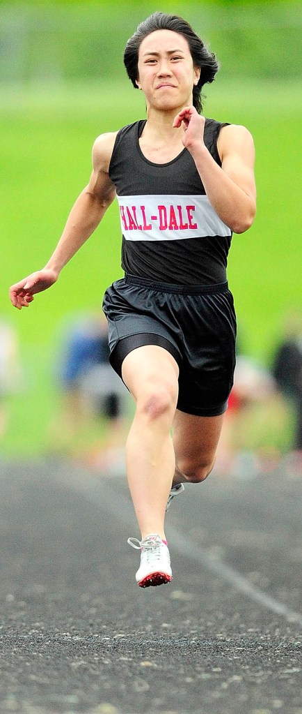 Staff photo by Joe Phelan Hall-Dale Bri Crisci runs the 100 meters during the Mountain Valley Conference track meet on Friday at Alumni Field in Augusta.