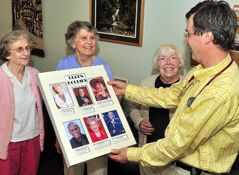 OLDIES BUT GOODIES: These patients of Dr. Roland Knausenberger enjoyed replacing a poster at his Waterville practice with one that depicts the elderly in a more positive and successful image this week. From left are Barbara Tracey, Marilyn Canavan and Betty Goulette.