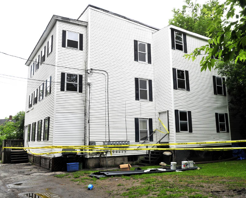 DO NOT ENTER: This apartment building on Elm Court in Waterville was damaged by fire last Sunday. Officials have declared the building unfit to live in because of unsafe conditions.