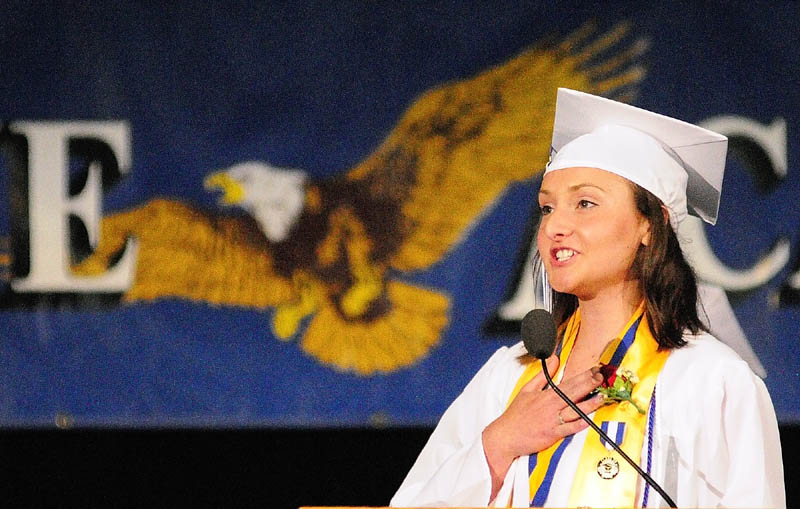 PLEDGE: Bethany Bernhardt leads the Pledge of Allegiance at Erskine Academy’s graduation on Friday at the Augusta Civic Center.